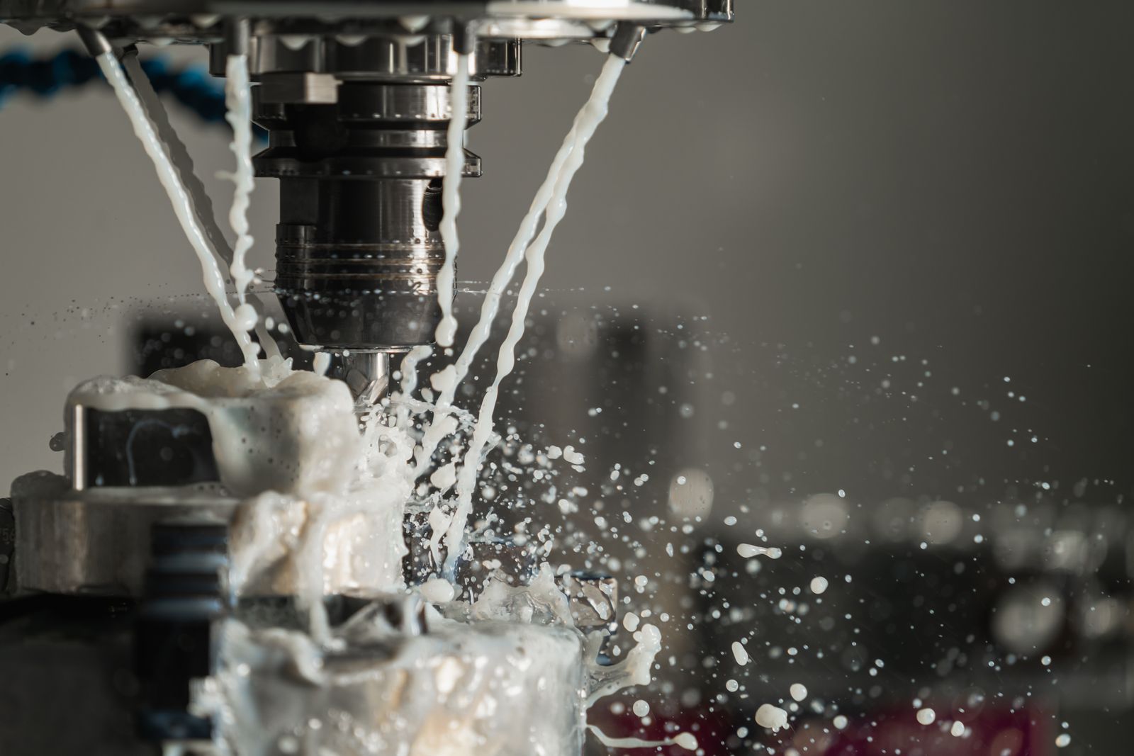Coolant stream over a cutting tool during a CNC turning operation