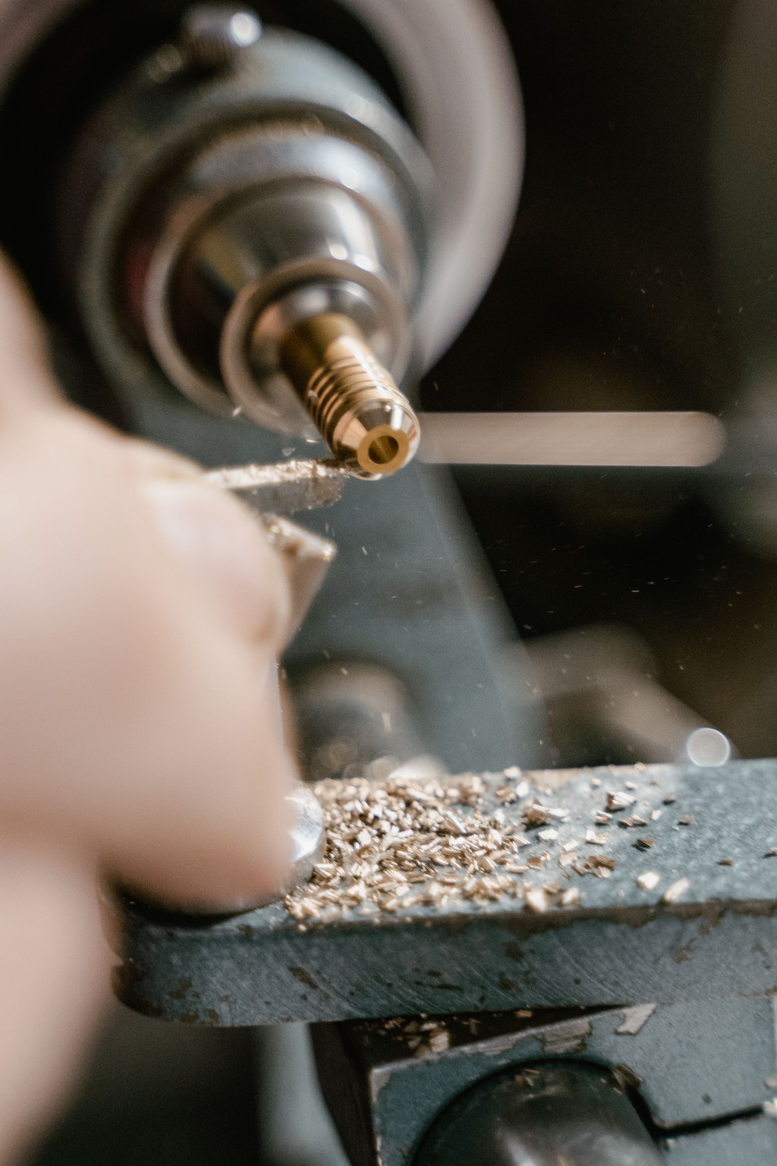 Brass workpiece being machined on a lathe